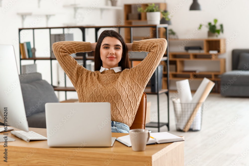 Young female programmer in office