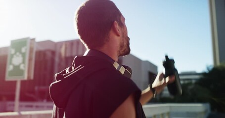 Canvas Print - Man, drinking water and fitness in city for exercise, running break and health, energy or workout in lens flare. Young thirsty athlete, tired runner or sports person with bottle for outdoor training