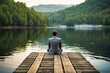 © JoyImage - Man in suit sitting on a dock gazing at the calm water of a serene lake. Created with Generative AI technology