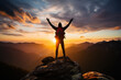 Cheering hiker open arms on top of a mountain at sunrise