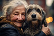 close up of old woman hugging her dog bokeh style background
