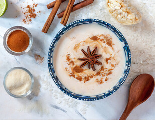 Wall Mural - A top-down shot of a Mexican horchata captures the creamy and cinnamon-infused rice milk, a popular and cooling drink enjoyed in Mexican cuisine