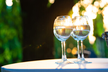 Champagne glasses on the buffet table. Table setting for a buffet at a party. 