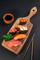 Wall Mural - Set of traditional japanese food on a dark background.