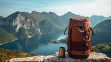 Camping Backpacks On Lake. Concept Of Travel, Vacation, Active Tourism, Hiking, Outdoor Adventure. Nature Background Of Amazing View With Blue Lake, Mountains.