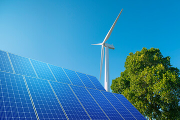 Wall Mural - wind turbine with solar panels in blue sky. concept of clean energy. energy supply, wind turbine, eo