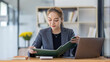 © David - Business asian woman working at office with documents on his desk, doing planning analyzing the financial report, business plan investment, finance analysis concept