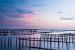 Sunset view of the Z-shaped Oyster sheds in front of Guanhai House in the Qigu Lagoon of Tainan, Taiwan. 