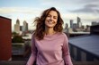 © CogniLens - Portrait of a blissful woman in her 30s showing off a thermal merino wool top against a vibrant city skyline. AI Generation