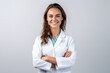 © Hope - Smiling young woman, graduate student medical therapist or pediatrician, standing in a medical gown with a stethoscope on her shoulders on a white isolated background