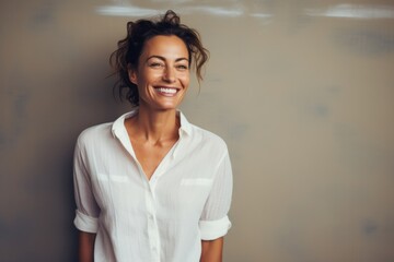 Sticker - Portrait of a happy woman in her 40s wearing a simple cotton shirt against a serene meditation room. AI Generation