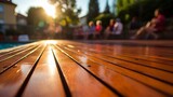 Fototapeta Londyn - Golden Sunset Glow Over Wooden Pool Deck with Relaxed Summer Evening Ambiance