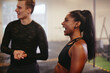 © Flamingo Images - Fit young woman laughing with a friend at the gym