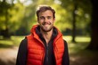 Portrait of a blissful man in his 30s dressed in a water-resistant gilet against a bright and cheerful park background. AI Generation