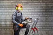 © Sergey - Worker is using angle grinder. Construction concept. Builder wearing in personal protective equipments.