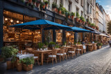 Fototapeta Londyn - Al fresco dining at a row of cafes and restaurants with tables and chairs arranged and lined up neatly outside by the streets of an European city for diners to have their meal out in the open air.