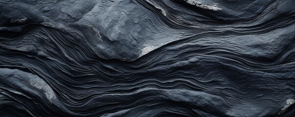 Wall Mural - A macro shot of a black lava stone surface with an abstract twist, emphasizing the natural imperfections and visual interest of the material.