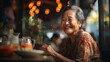an elderly asian woman sitting in a restaurant and smiling, AI generated