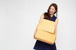 © comzeal - Happy Young Asian businesswoman smile and holding package parcel box isolated on white background, Delivery courier and shipping service concept