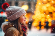 Close up side profile view of girl child standing next to a Christmas tree in the city, snow in the city square, christmas market, winter season, happy holidays