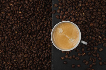 Cup of espresso coffee on a background of coffee beans