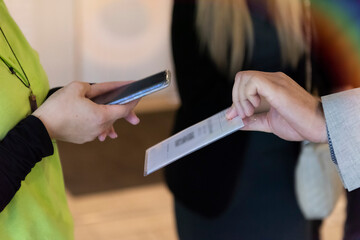 event qr code ticket scanning. businessman registering for a business conference using his smart pho