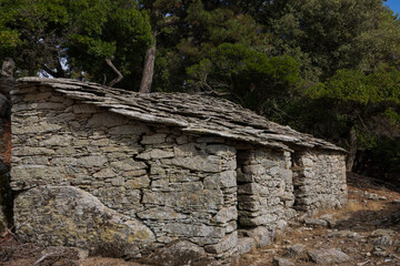 Old abandoned stone house with slate roof on the greek island of Ikaria.