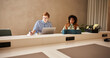© Flamingo Images - Diverse businesspeople working at a desk