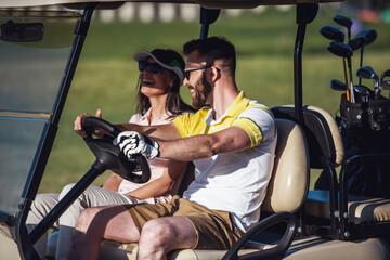 Wall Mural - Couple playing golf