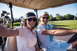 © georgerudy - Couple playing golf