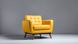 Yellow button tufted soft cushioned leather armchair on gray background. Interior design modern furniture concept. Banner with copy space