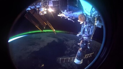 Wall Mural - flying over earth at night. northern lights aurora at night from above. view from international spac
