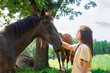 © ADDICTIVE STOCK - Peaceful encounter between woman and horse in nature