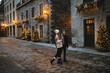 © ADDICTIVE STOCK - Couple enjoying a festive Christmas street scene in Quebec, Canada