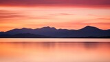 Fototapeta Zachód słońca - Sunset over mountains with lake and background mountains.