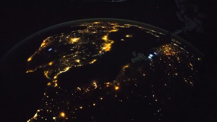 Wall Mural - cities illumination at night seen from space. flying over planet earth. view from international spac