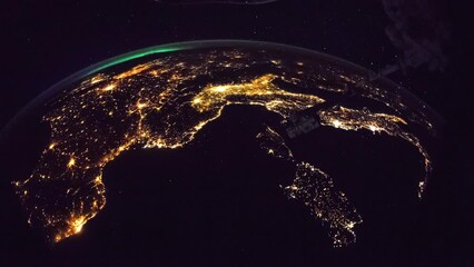 Wall Mural - cities illumination at night seen from space. flying over planet earth. view from international spac