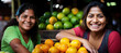 Young latin american smiling women posing at the fruit store she works