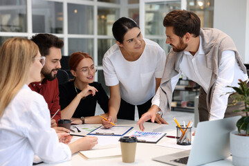 Sticker - Team of employees working together in office