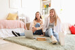 © Pixel-Shot - Female students studying in dorm room