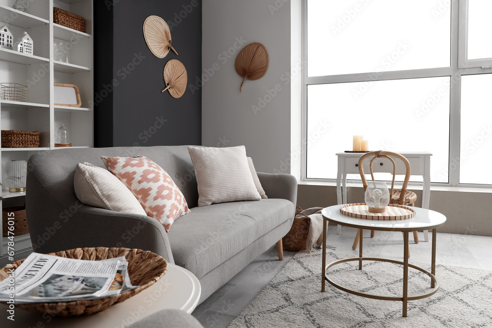 Interior of living room with sofa and tables