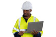 © amorn - Portrait of male engineer wear uniform and helmet standing and working laptop computer on white background