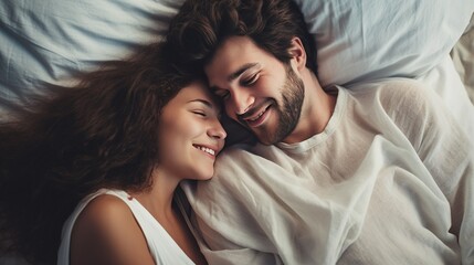  Top view of a very happy 1 young beautiful couple in bed