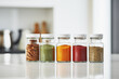 Close up of glass container of spices on reflection marble table in background of modern kitchen. Cooking concept of powder and seasoning.