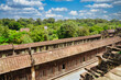 A view of the main gallery and quadrangle of the Angkor Wat temple complex from the top of the temple with surrounding countryside at Siem Reap, Cambodia, Asia