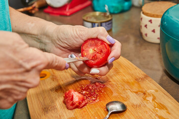 Canvas Print - Chef is preparing tomatoes for stuffing. French gourmet food