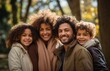© radekcho - Happy married couple with children on a walk.  Dad and mommy hugging them beautiful kids and looking on the camera. Power in happy big family.