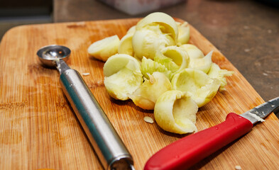 Poster - Cut zucchini inside around shape on board in home kitchen