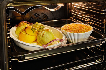 Poster - Stuffed zucchini and pie are baked in an electric oven