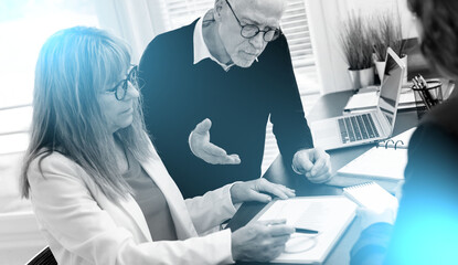 Poster - Group of three coworkers during business meeting; light effect